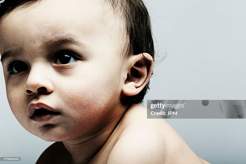 Portrait of baby boy looking away