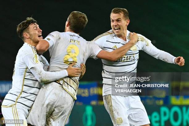 Saarbruecken's players celebrate after winning the German Cup second round football match 1 FC Saarbruecken v FC Bayern Munich at Ludwigspark stadium...