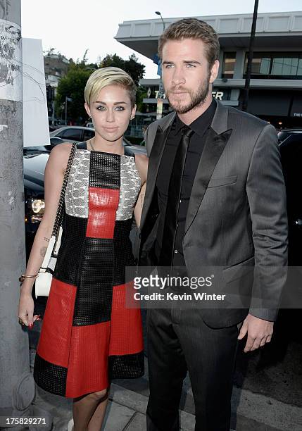 Actress Miley Cyrus and actor Liam Hemsworth attend the premiere of Relativity Media's "Paranoia" at the DGA Theater on August 8, 2013 in Los...