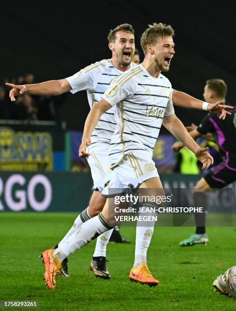 Saarbruecken's players celebrate after winning the German Cup second round football match 1 FC Saarbruecken v FC Bayern Munich at Ludwigspark stadium...