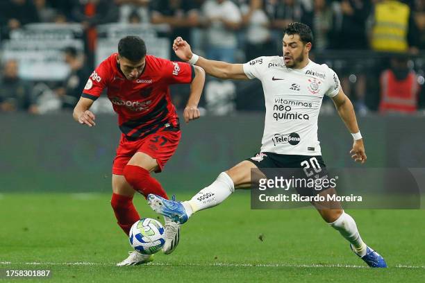Lucas Esquivel of Athletico Paranaense fights for the ball with Giuliano of Corinthians during the match between Corinthians and Athletico Paranaense...