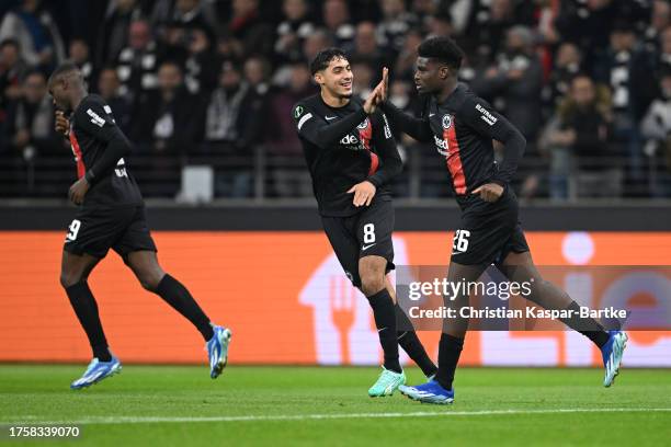 Junior Dina Ebimbe of Eintracht Frankfurt celebrates with Fares Chaibi of Eintracht Frankfurt after scoring the team's first goal during the UEFA...