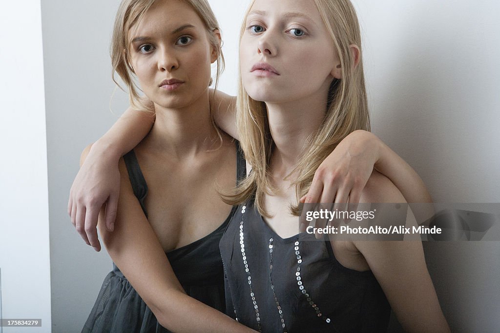 Female friends embracing, portrait