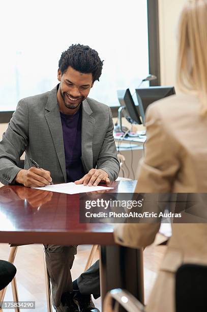 Woman Completing Paperwork Photos and Premium High Res Pictures - Getty ...