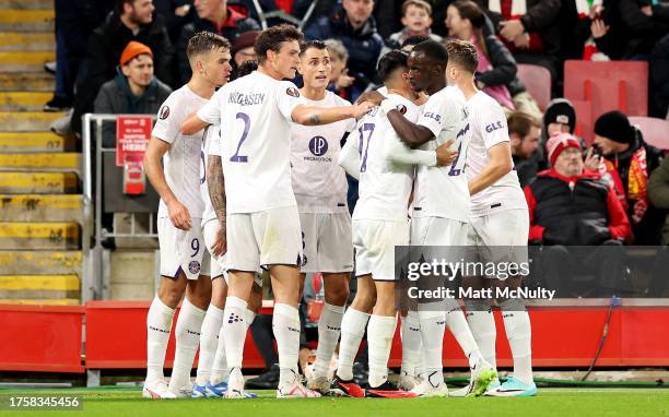 Thijs Dallinga of Toulouse celebrates with teammates after scoring the team's first goal to equalise during the UEFA Europa League 2023/24 match...