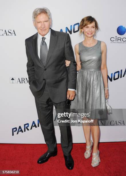 Actor Harrison Ford and actress Calista Flockhart arrive at the Los Angeles Premiere "Paranoia" at DGA Theater on August 8, 2013 in Los Angeles,...