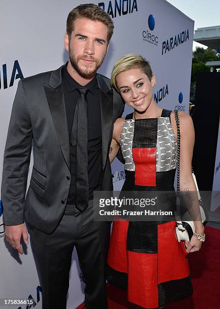 Actor Liam Hemsworth and singer Miley Cyrus attend the premiere of Relativity Media's "Paranoia" at DGA Theater on August 8, 2013 in Los Angeles,...