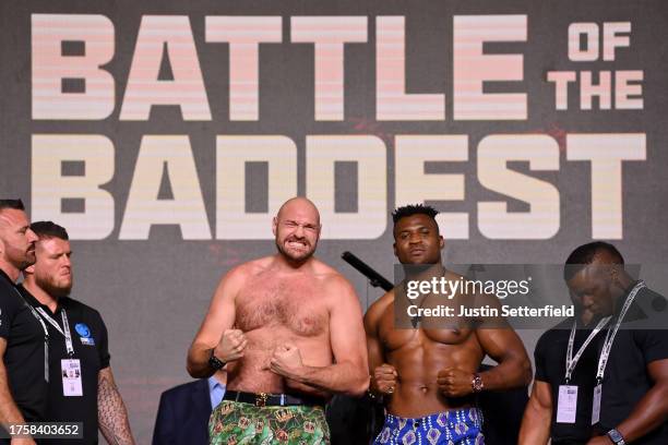 Tyson Fury and Francis Ngannou react in the face off during a press conference ahead of the Tyson Fury v Francis Ngannou boxing match at Boulevard...