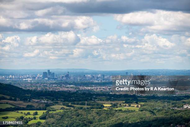 the city of manchester as seen from a distant hilltop - north england stock pictures, royalty-free photos & images