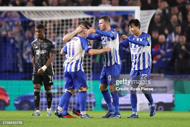 Billy Gilmour, Pascal Gross and Kaoru Mitoma celebrate their sides second goal by Ansu Fati of Brighton & Hove Albion during the UEFA Europa League...