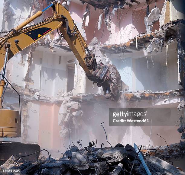 germany, wiesbaden, view of demolishing house with hydraulic cutter crane - collapsing stock pictures, royalty-free photos & images