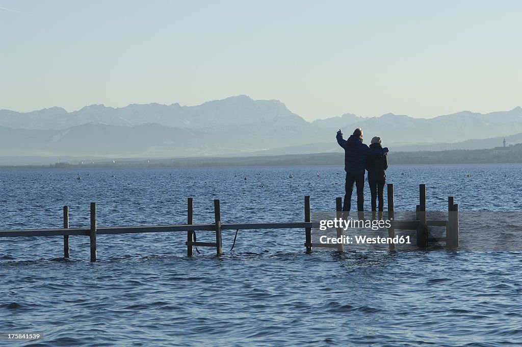 Europe, Germany, Bavaria, Man and woman relaxing at Lake Ammersee
