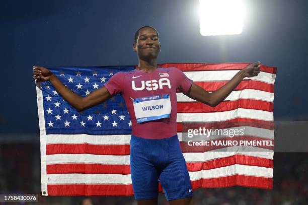 De'Vion Wilson celebrates after finishing in second place in the men's 110m hurdles final of the Pan American Games Santiago 2023 at the National...
