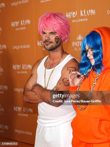 Taylor Lautner and Taylor Dome are seen arriving at Heidi Klum's 22nd Annual Halloween Party on October 31, 2023 in New York City.