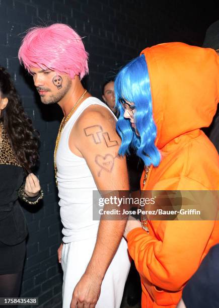 Taylor Lautner and Taylor Dome are seen arriving at Heidi Klum's 22nd Annual Halloween Party on October 31, 2023 in New York City.