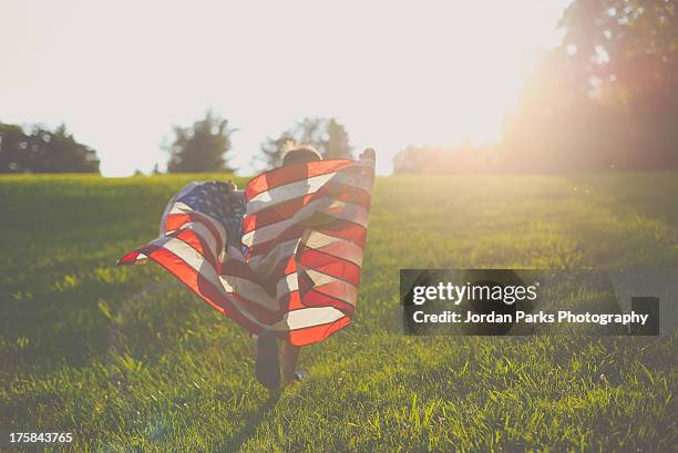 july 4th - holding flag stock pictures, royalty-free photos & images