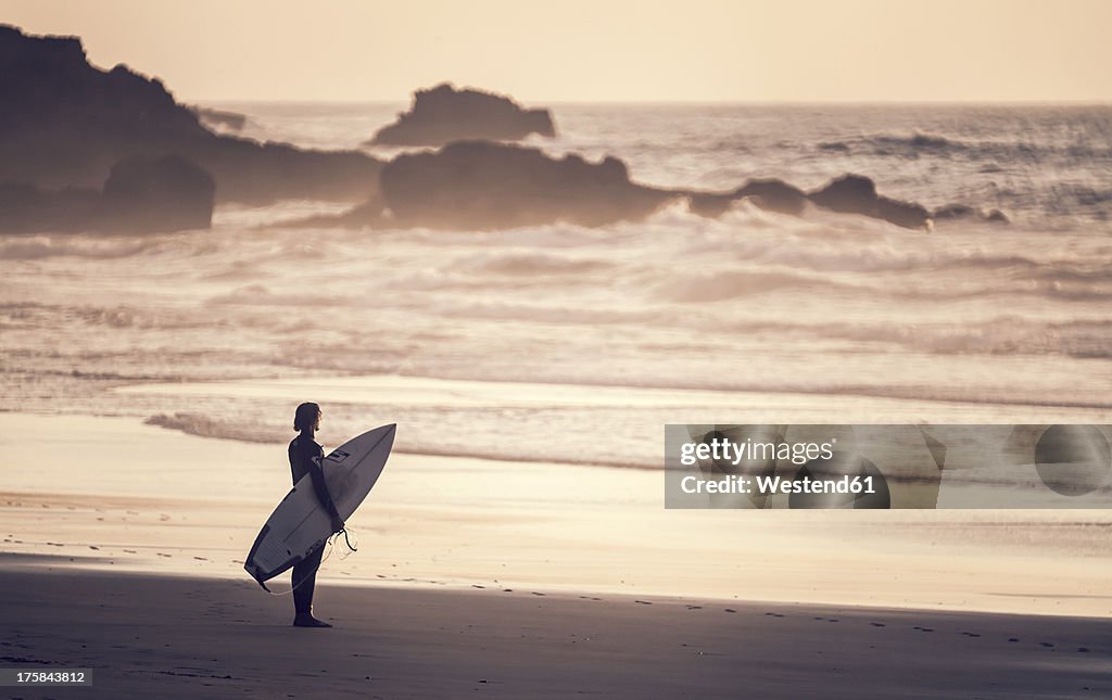 Portugal, Surfer at Praia do Castelejo