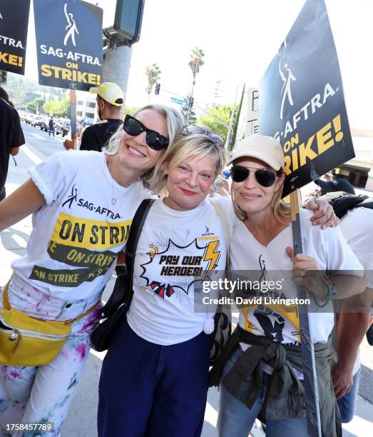 Ever Carradine, Martha Plimpton and Jeri Ryan join the picket line outside Warner Bros. Studios on October 26, 2023 in Burbank, California. SAG-AFTRA...