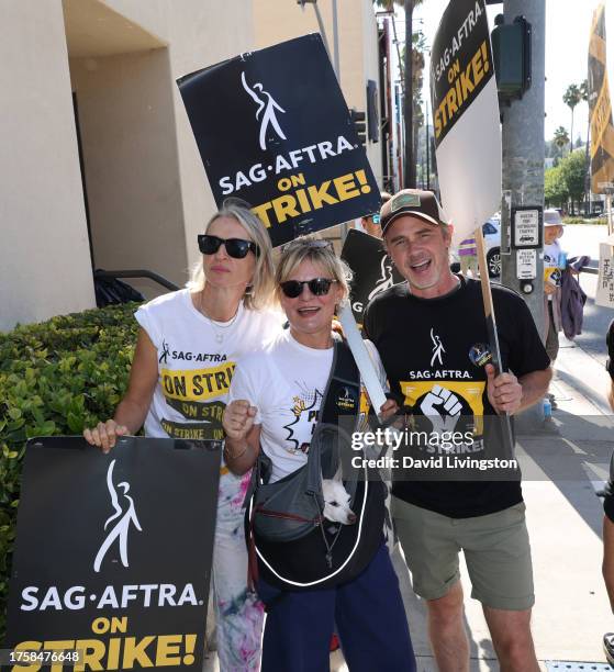 Ever Carradine, Martha Plimpton and Sam Trammell join the picket line outside Warner Bros. Studios on October 26, 2023 in Burbank, California....