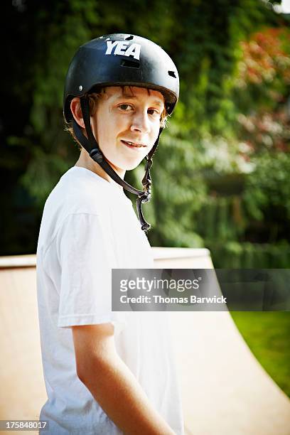 portrait of boy standing in backyard halfpipe - half pipe stock-fotos und bilder