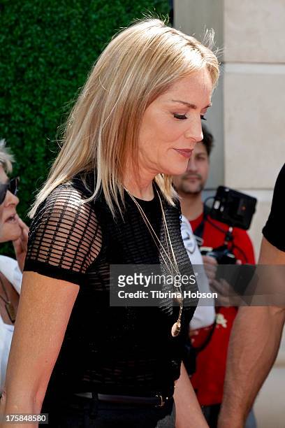 Sharon Stone attends the 4th annual Kiehl's LifeRide for amfAR at The Grove on August 8, 2013 in Los Angeles, California.