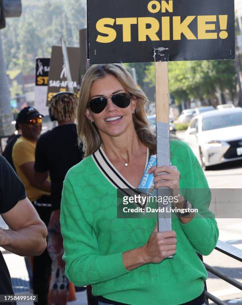 Tricia Helfer joins the picket line outside Warner Bros. Studios on October 26, 2023 in Burbank, California. SAG-AFTRA has been on strike since July...