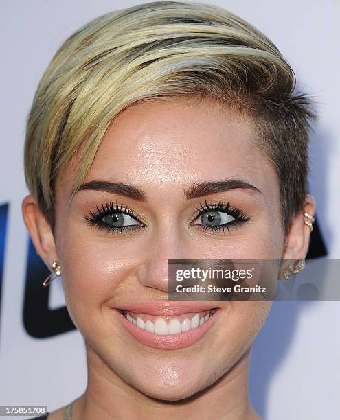 Miley Cyrus arrives at the "Paranoia" - Los Angeles Premiere at DGA Theater on August 8, 2013 in Los Angeles, California.