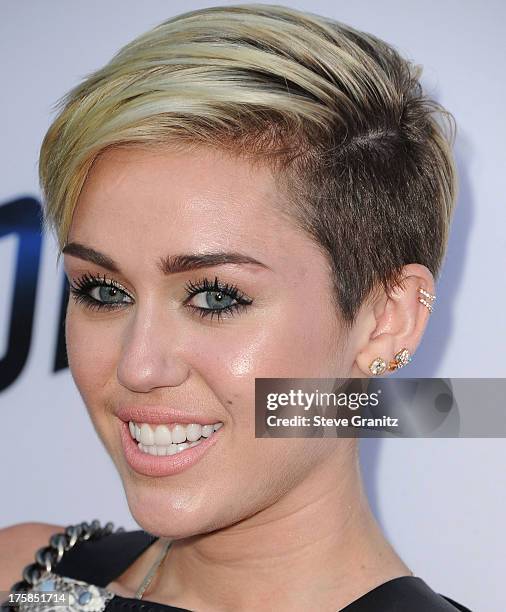 Miley Cyrus arrives at the "Paranoia" - Los Angeles Premiere at DGA Theater on August 8, 2013 in Los Angeles, California.