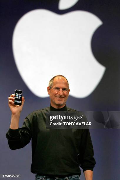 Apple chief executive Steve Jobs unveils a new mobile phone that can also be used as a digital music player and a camera, a long-anticipated device...