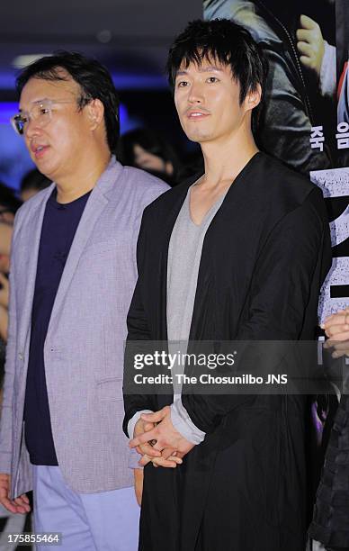 Director Kim Sung-Soo and Jang Hyuk attend the 'The Flu' VIP press screening at Wangsimni CGV on August 7, 2013 in Seoul, South Korea.