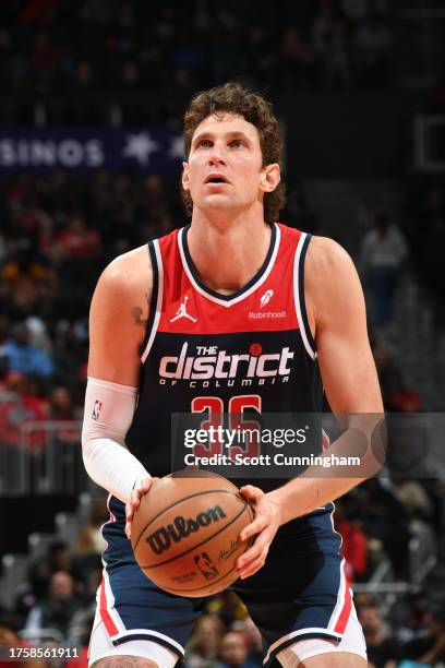 Mike Muscala of the Washington Wizards shoots a free throw during the game against the Atlanta Hawks on November 1, 2023 at State Farm Arena in...