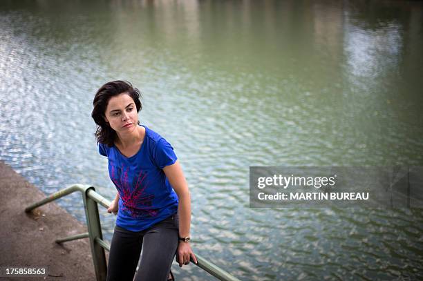 French actress Olga Babluani poses on July 29, 2013 in Paris. Olga Babluani stars in the film "Keep Smiling" by Georgian director Rusudan Chkonia to...