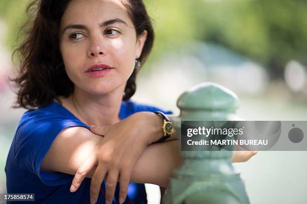 French actress Olga Babluani poses on July 29, 2013 in Paris. Olga Babluani stars in the film "Keep Smiling" by Georgian director Rusudan Chkonia to...