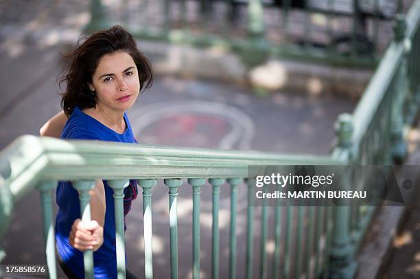 French actress Olga Babluani poses on July 29, 2013 in Paris. Olga Babluani stars in the film "Keep Smiling" by Georgian director Rusudan Chkonia to...