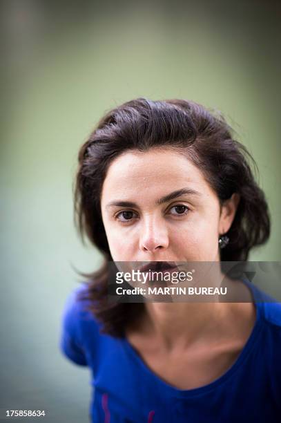 French actress Olga Babluani poses on July 29, 2013 in Paris. Olga Babluani stars in the film "Keep Smiling" by Georgian director Rusudan Chkonia to...