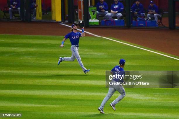 Travis Jankowski of the Texas Rangers catches a fly ball during Game 5 of the 2023 World Series between the Texas Rangers and the Arizona...