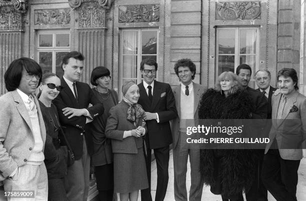 French Minister of Culture Jack Lang pose with famous fashion designers before a lunch organized during the automn-winter fashion show in Paris on...