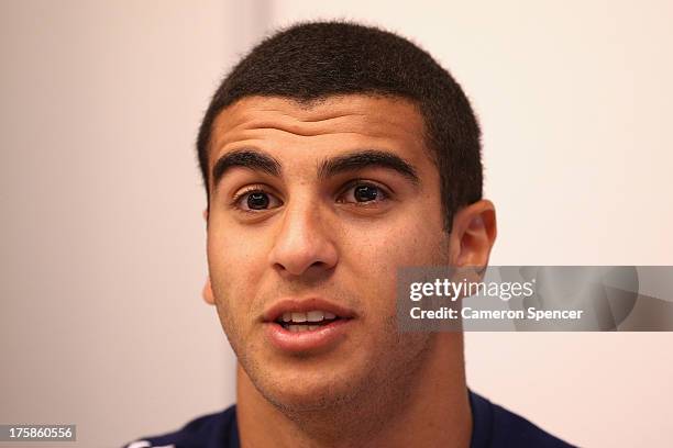 Adam Gemili of Great Britain talks during a British Athletics press conference at the Crowne Plaza Hotel ahead of the 14th IAAF World Athletics...