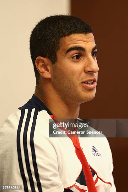 Adam Gemili of Great Britain talks during a British Athletics press conference at the Crowne Plaza Hotel ahead of the 14th IAAF World Athletics...