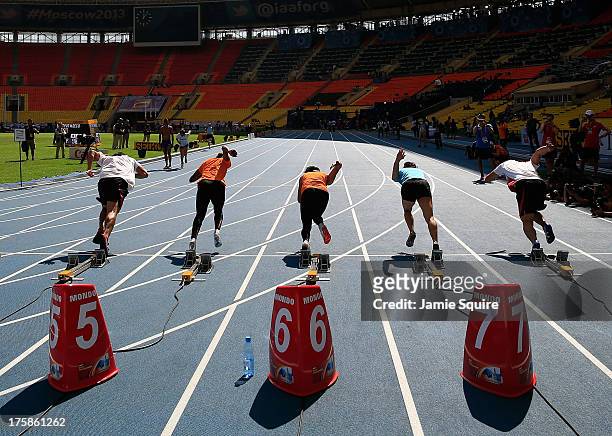 Athletes in action during a practice start ahead of the 14th IAAF World Athletics Championships Moscow 2013 at the Luzhniki Sports Complex on August...