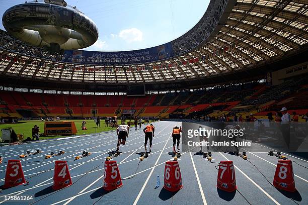 Athletes in action during a practice start ahead of the 14th IAAF World Athletics Championships Moscow 2013 at the Luzhniki Sports Complex on August...
