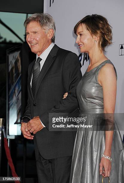 Actors Harrison Ford and Calista Flockhart arrive at the 'Paranoia' - Los Angeles Premiere at DGA Theater on August 8, 2013 in Los Angeles,...