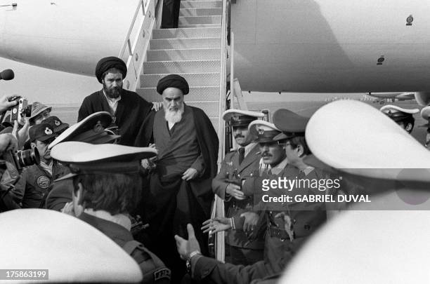 Photo taken 01 February 1979 at Tehran airport of revolutionary leader Ayatollah Ruhollah Khomeini leaving the Air France Boeing 747 jumbo that flew...