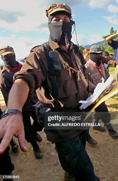 The leader of the Mexican Zapatista Army of National Liberation Subcomandante Marcos walks after the Zapatista plenary in La Garrucha community,...