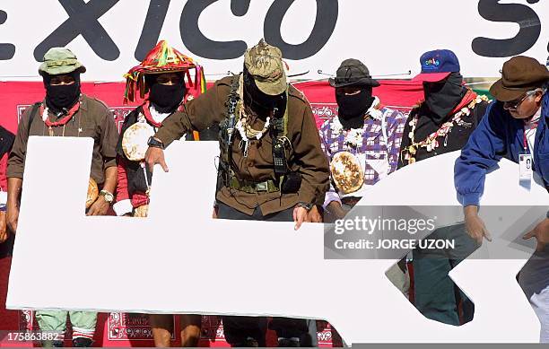 Zapatista Subcommander Marcos and Commander German hold a big key during their arrival ceremony in the Zolaco of Mexico City, Mexico, 11 March 2001....