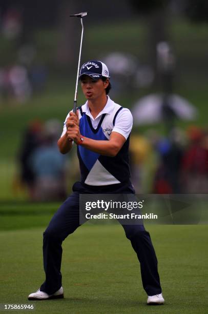 Ryo Ishikawa of Japan reacts on the 13th green during the second round of the 95th PGA Championship on August 9, 2013 in Rochester, New York.