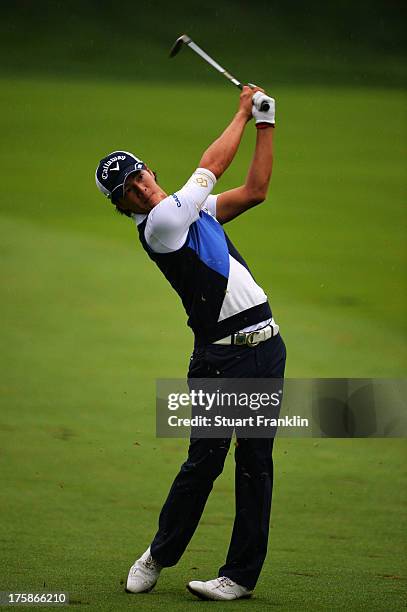 Ryo Ishikawa of Japan hits an approach shot on the 14th hole during the second round of the 95th PGA Championship on August 9, 2013 in Rochester, New...