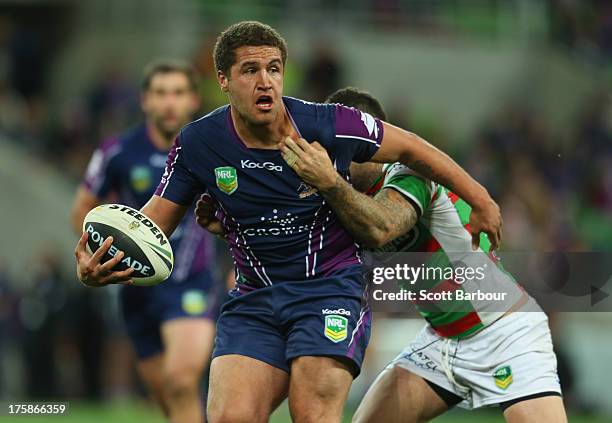 Kenneath Bromwich of the Storm runs with the ball during the round 22 NRL match between the Melbourne Storm and the South Sydney Rabbitohs at AAMI...