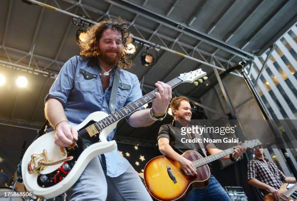 Guitarist James Young of Eli Young Band perform during "FOX & Friends" All American Concert Series outside of FOX Studios on August 9, 2013 in New...