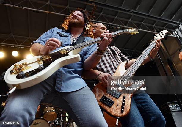 James Young and Jon Jones of Eli Young Band perform during "FOX & Friends" All American Concert Series outside of FOX Studios on August 9, 2013 in...